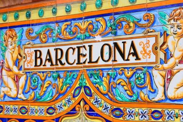 A vibrant sign displaying the word "Barcelona" in colorful letters.